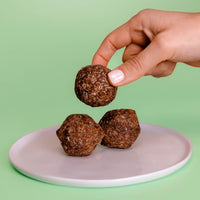 Urban Brew Energy balls with guarana with hand holding it